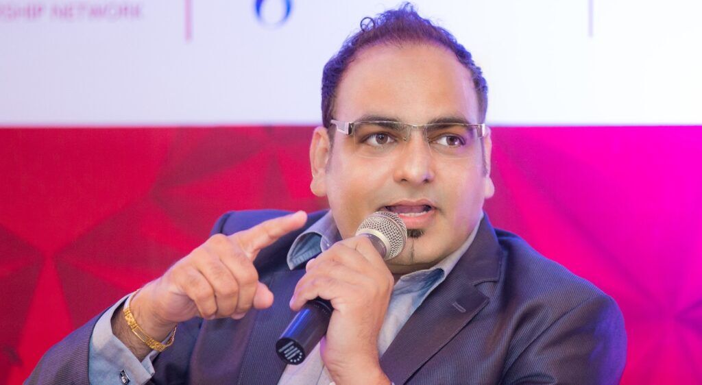 Picture of Dr. Prem Jagyasi responding in a technology Conference in Chennai India.